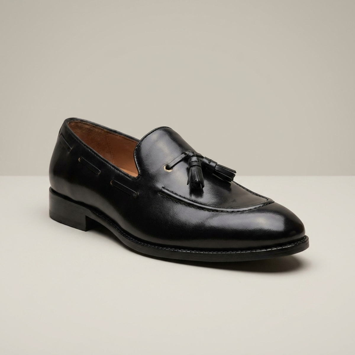 PLUXSTYLE::numise::adam-black-tassel-loafers::closeup-hero