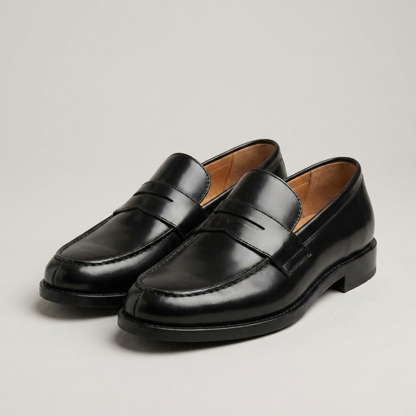 PLUXSTYLE::numise::mens-black-penny-loafers::closeup-detail
