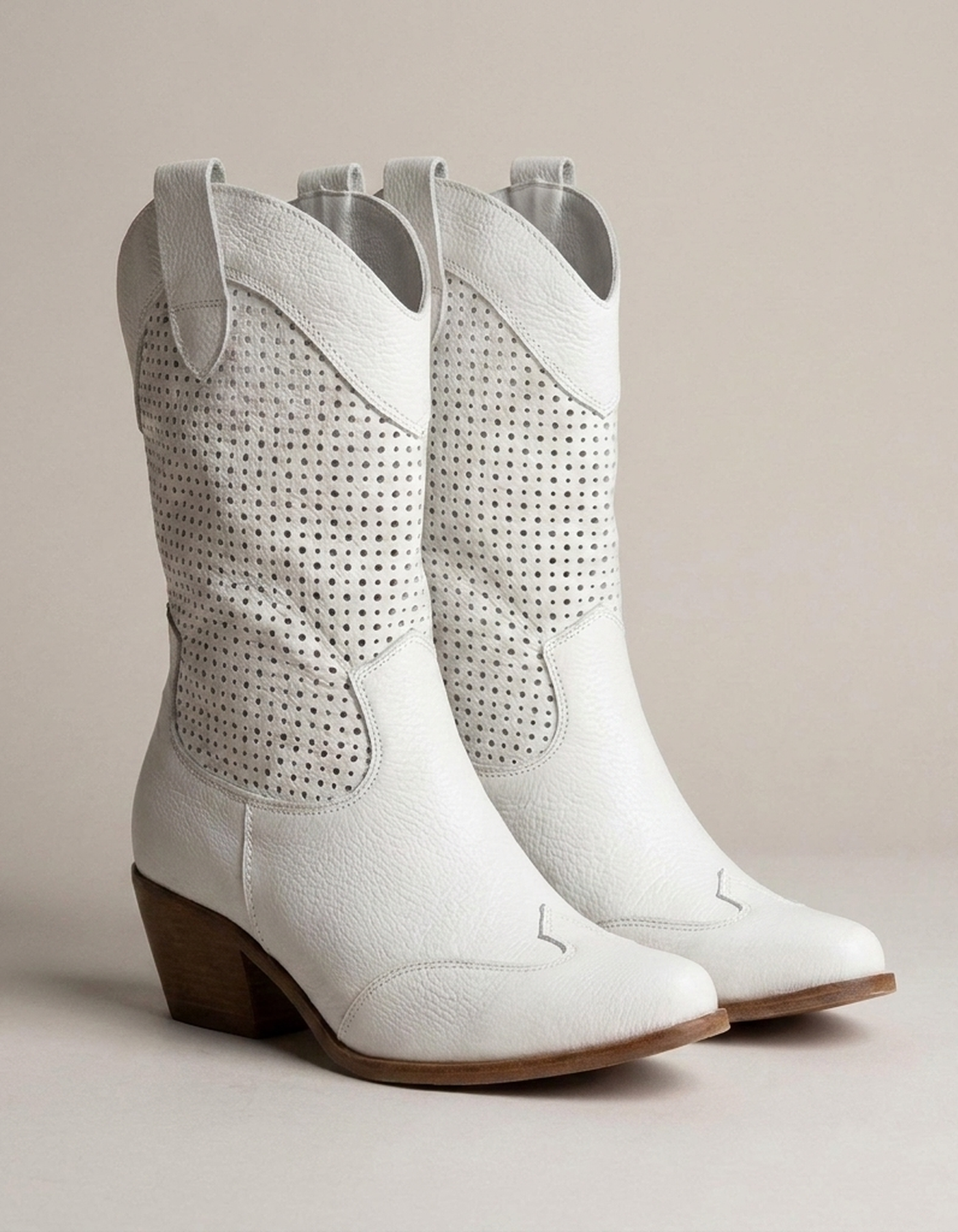 PLUXSTYLE::numise::amelia-perforated-cowboy-boots::closeup-detail