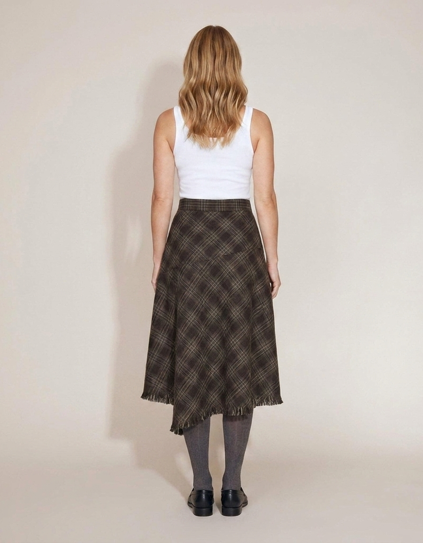 PLUXSTYLE::numise::annie-asymmetric-plaid-fringe-skirt::back