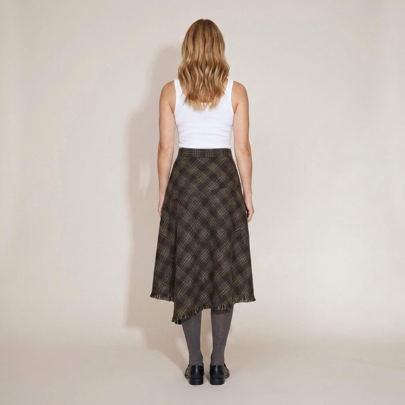PLUXSTYLE::numise::annie-asymmetric-plaid-fringe-skirt::back
