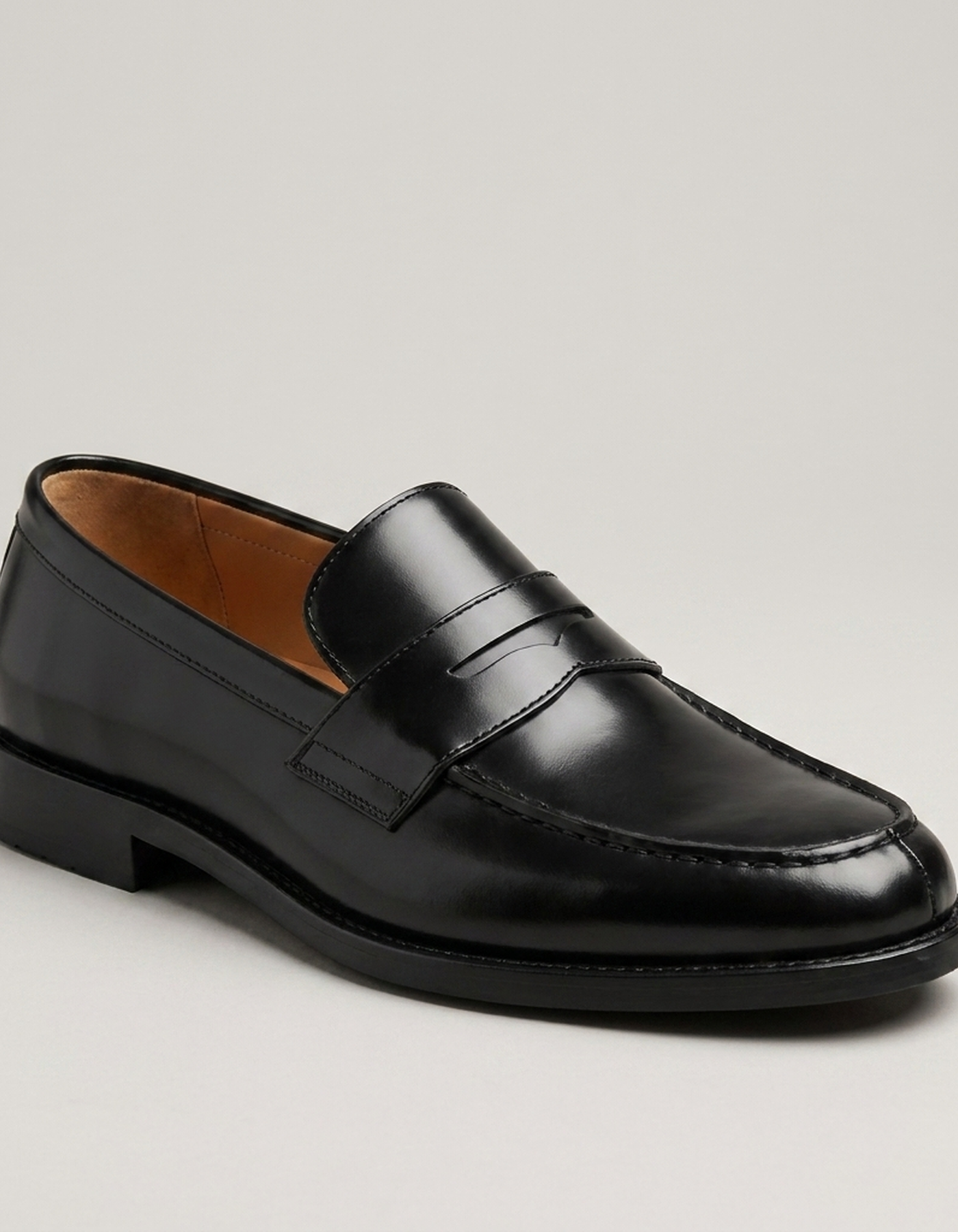 PLUXSTYLE::numise::mens-black-penny-loafers::closeup-hero