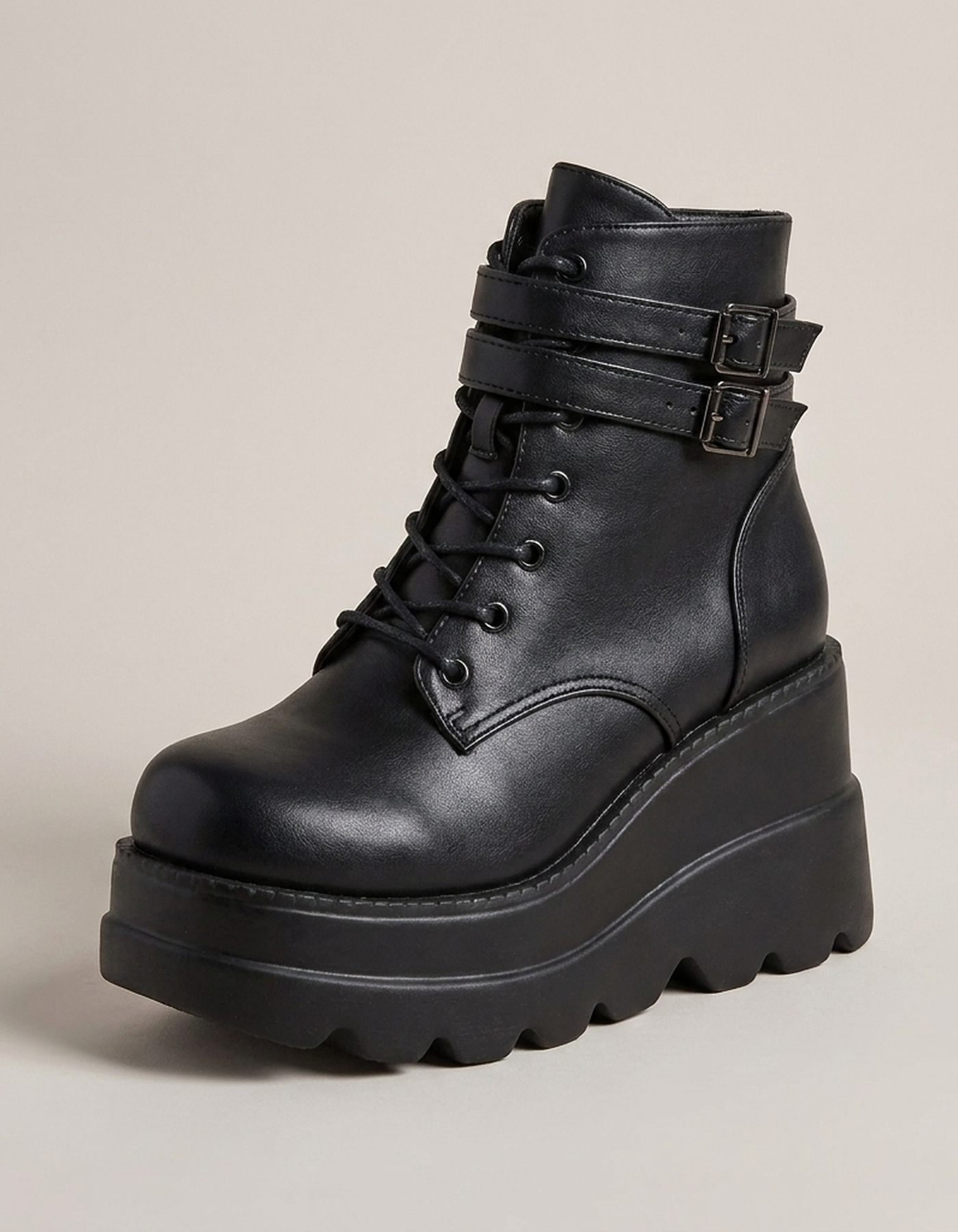 PLUXSTYLE::numise::studded-platform-combat-boots::closeup-hero