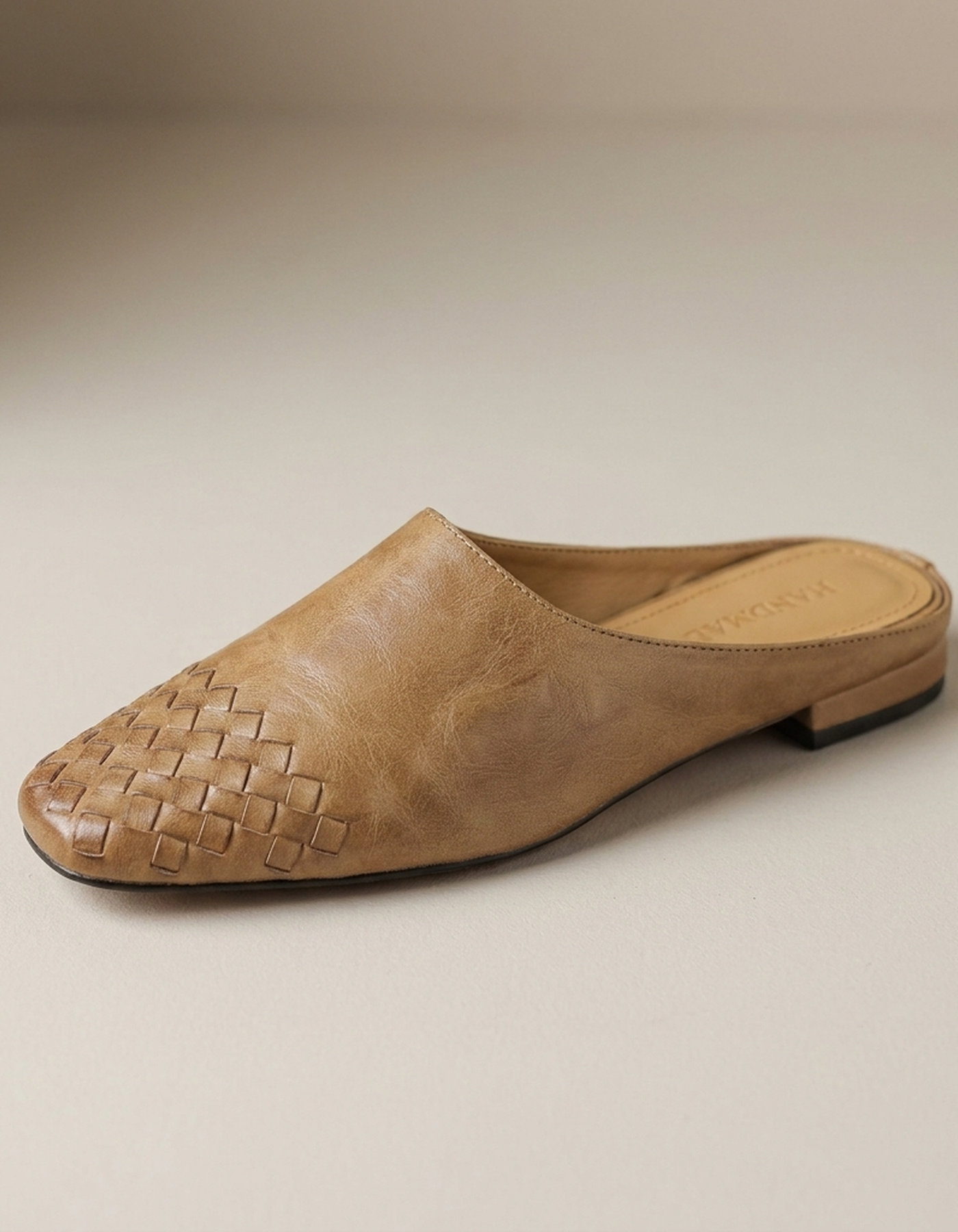 PLUXSTYLE::numise::woven-square-toe-mules::closeup-hero