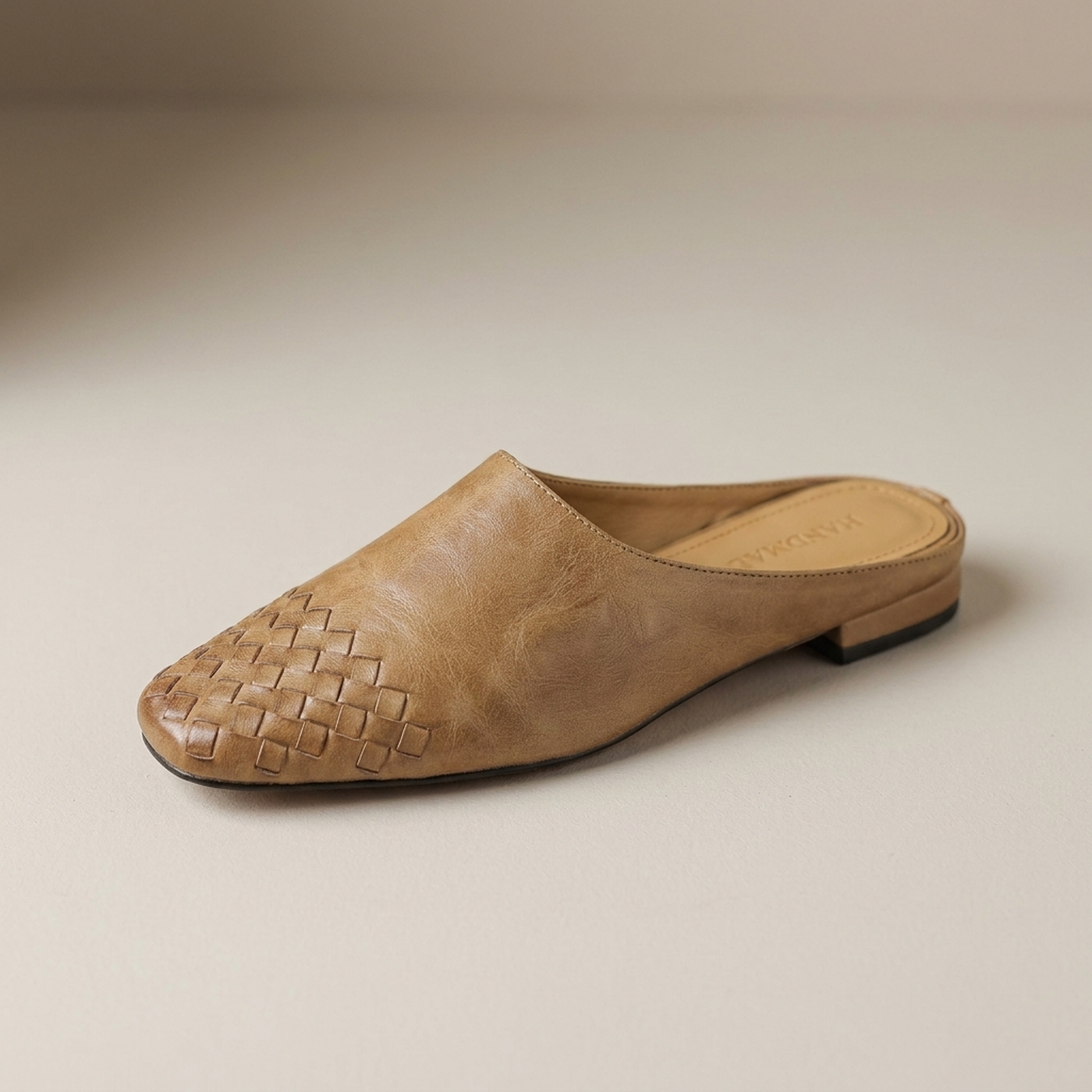 PLUXSTYLE::numise::woven-square-toe-mules::closeup-hero