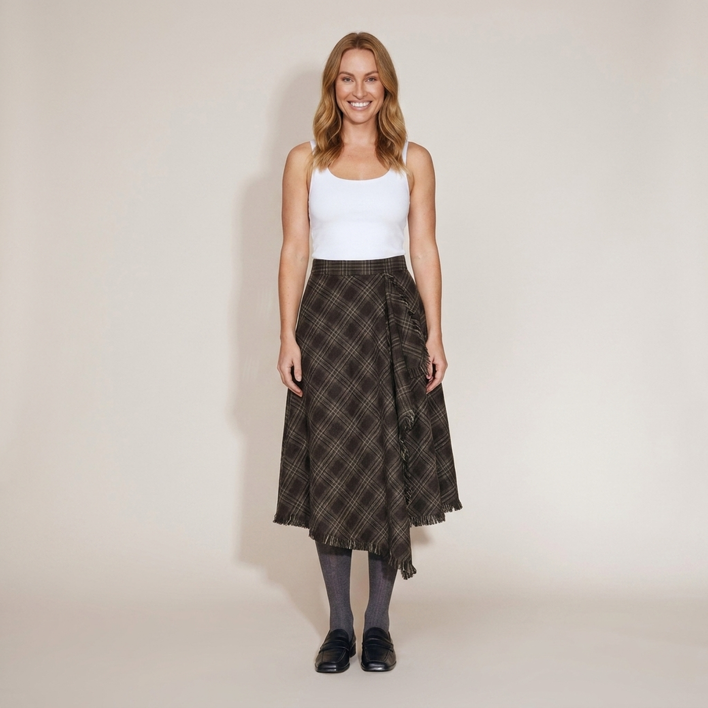 PLUXSTYLE::numise::annie-asymmetric-plaid-fringe-skirt::front