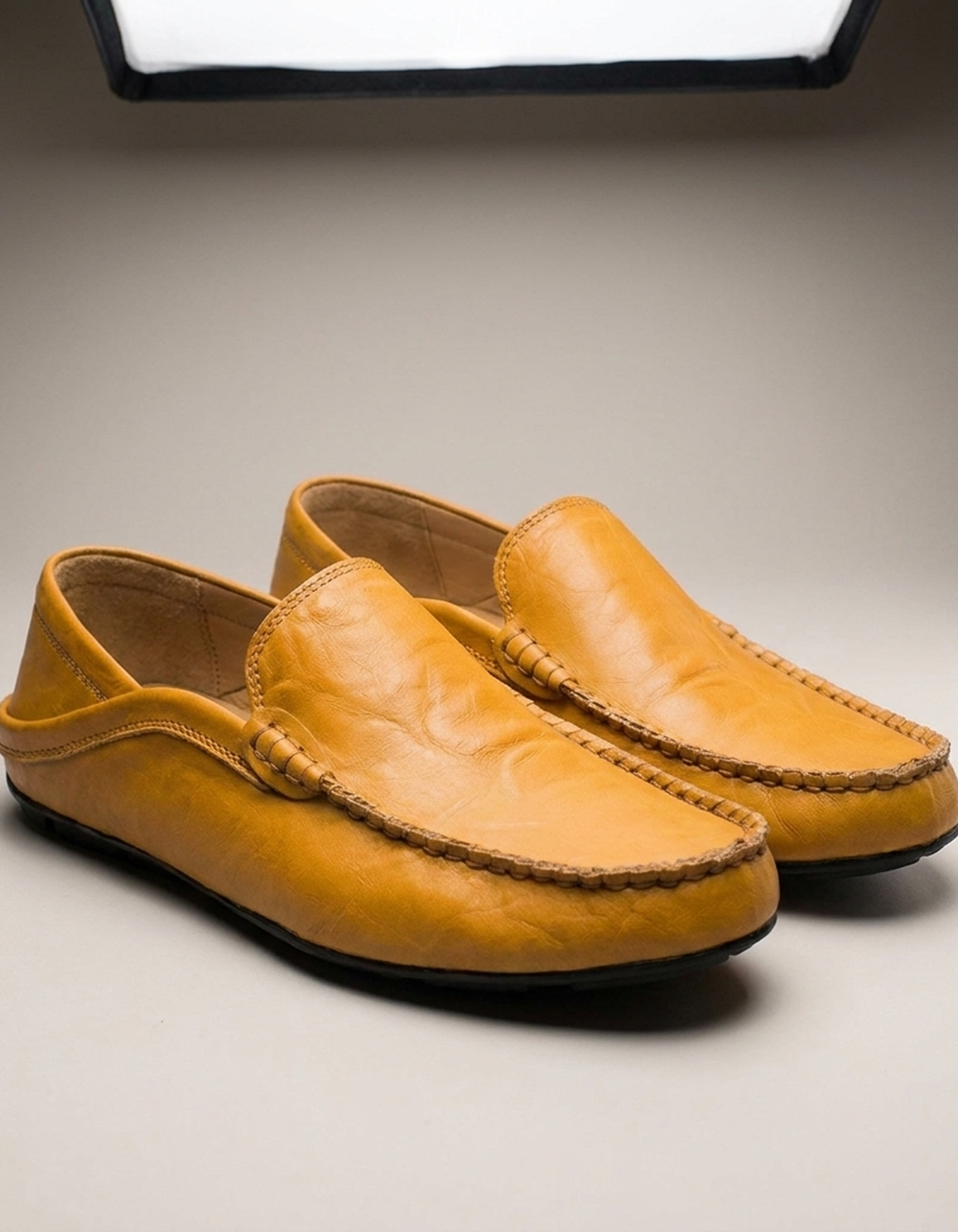 PLUXSTYLE::numise::mens-contrast-stitch-penny-loafers-1::closeup-detail