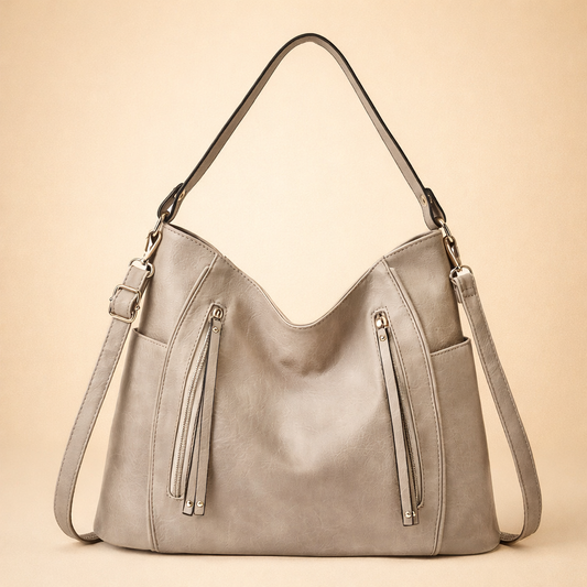 Ampia borsa tote da spalla con elegante dettaglio a nappa