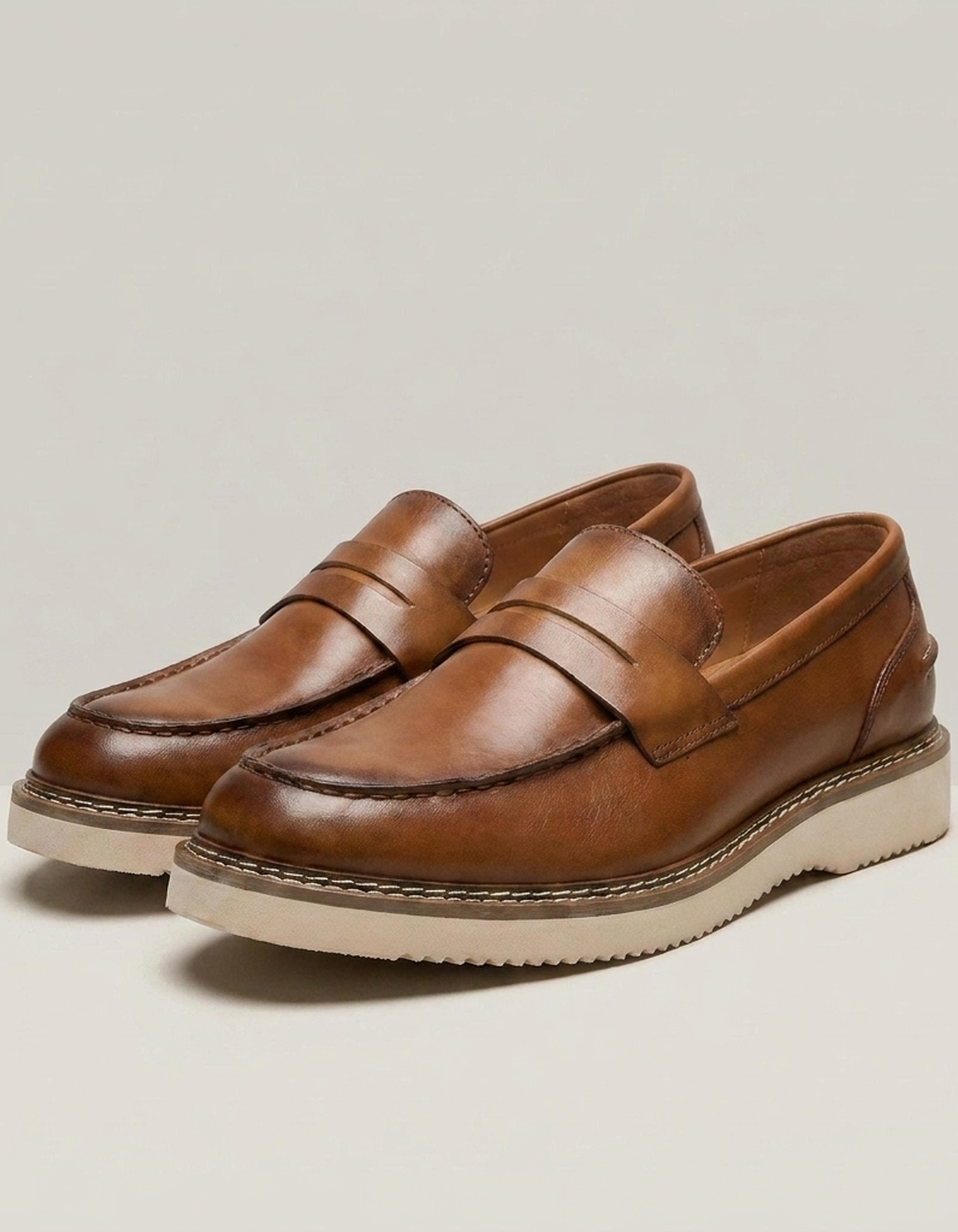 PLUXSTYLE::numise::bergamo-polished-penny-loafers::closeup-detail